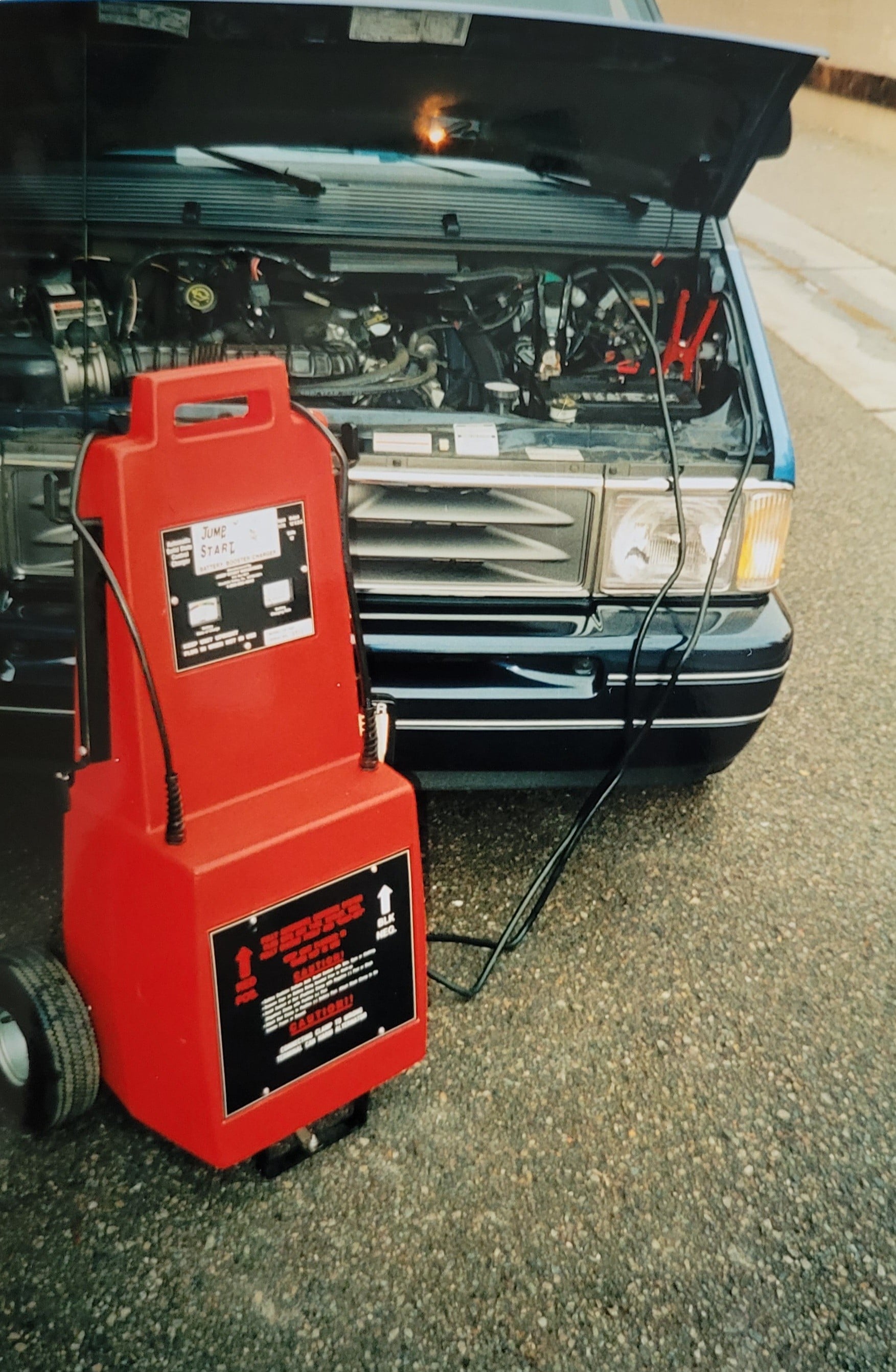 Jump Starter Connected To The Car